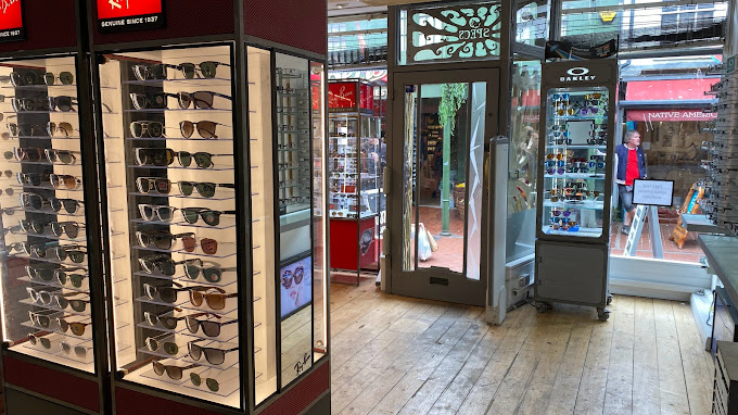 "Interior of Specs Opticians shop featuring Ray-Ban and Oakley displays."